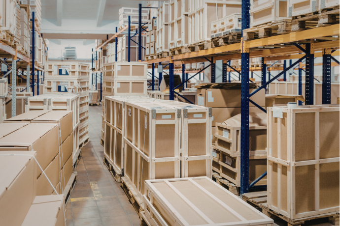 Warehouse with large boxes on the floor and shelving