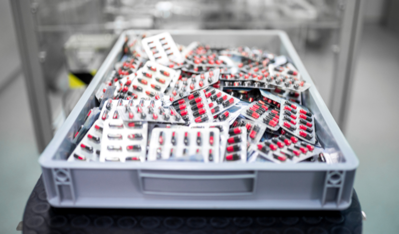 Blister packs of tablets in a crate