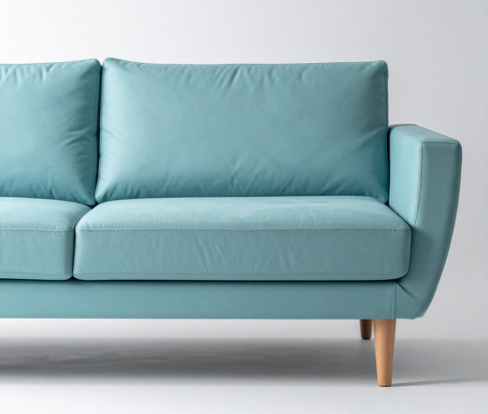 Seagreen sofa with wooden legs standing on grey background