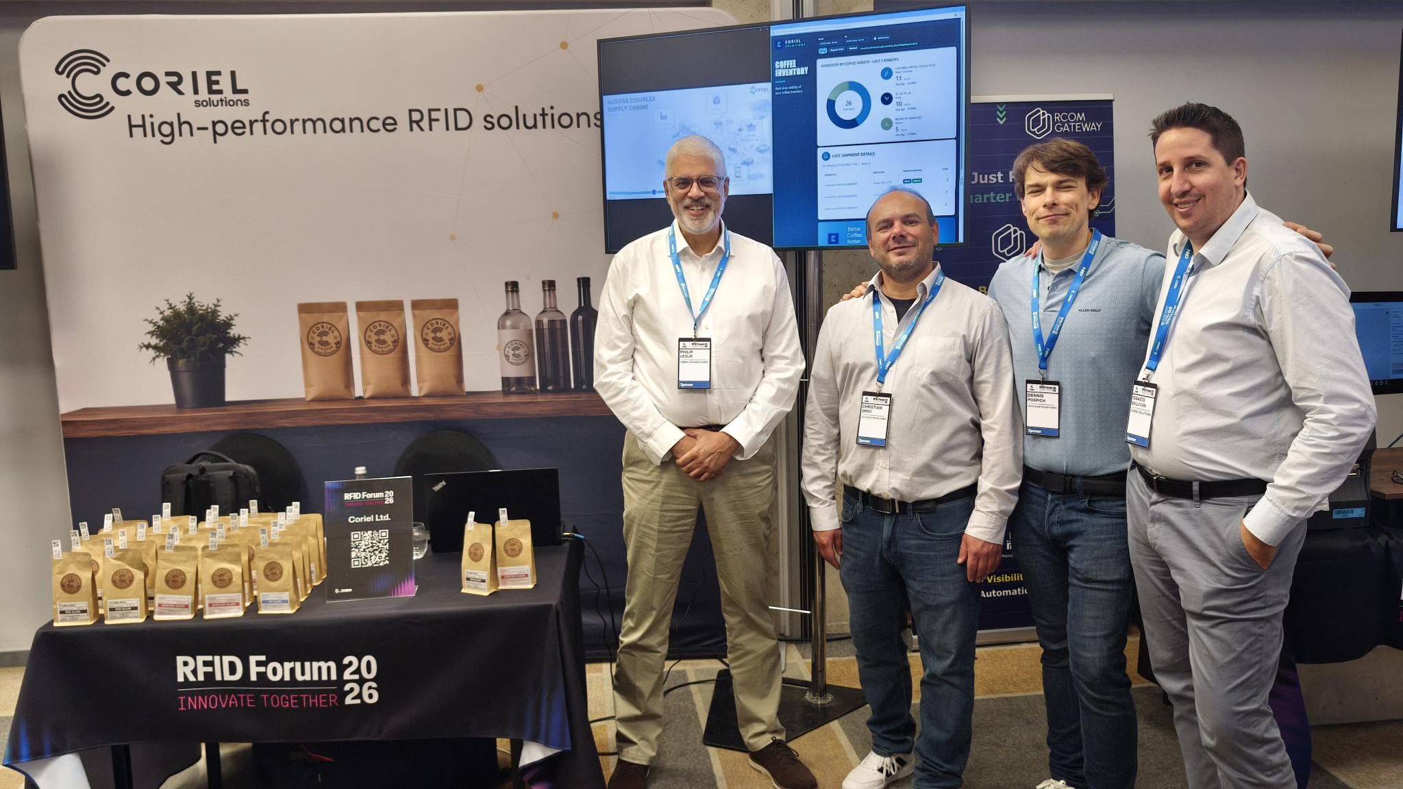 The Coriel team standing in front of their stand space.