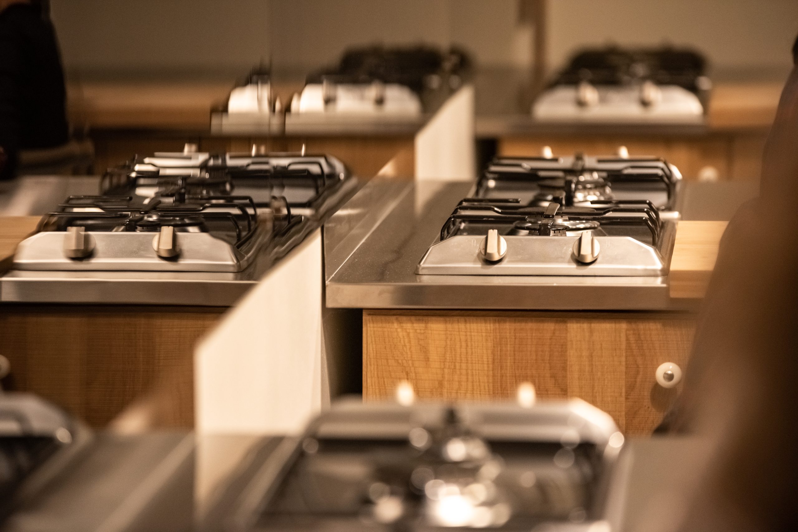 Seagreen sofa with wooden legs standing on grey background